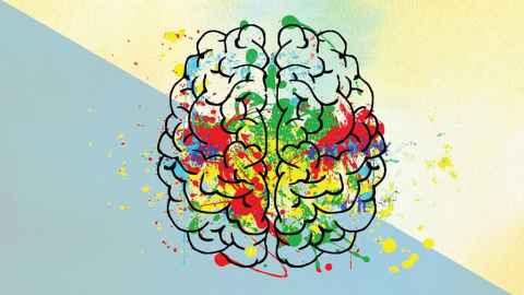 brain with multicoloured paint splatters over it. 
