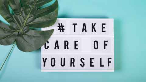 A sign that says "# take care of yourself"