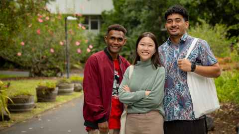 Three smiling students