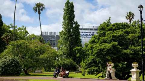 Students in Albert Park with Hiwa in the background on a sunny day