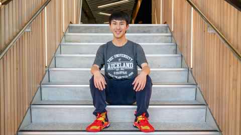 Smiling man sitting on steps
