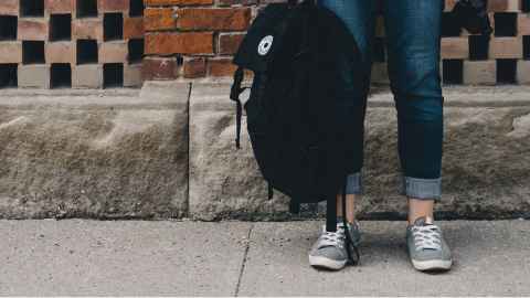 Student holding bag