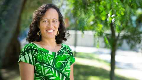 a woman wearing a green patterned t-shirt