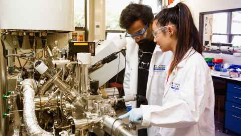 Two people in lab coats.