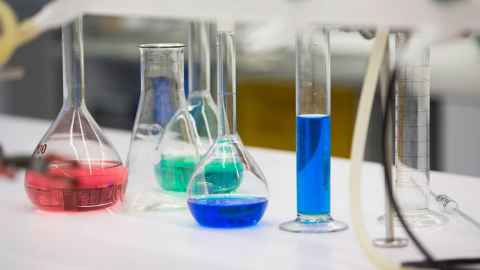 Various liquids in beakers.