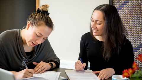 Two women studying together