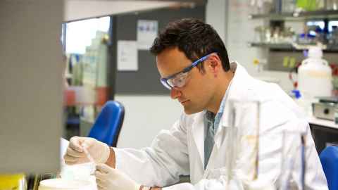 A man working in a lab.