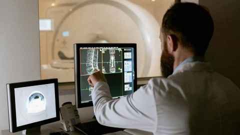 Man checking screen scans