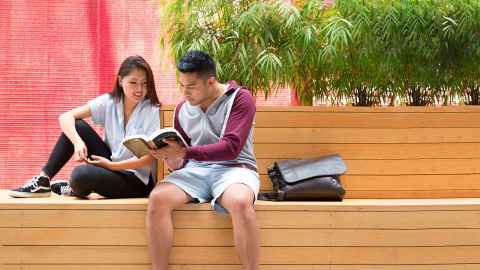 students sitting outdoors