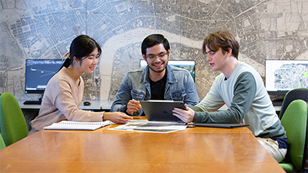 Three students around a table