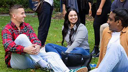 Three students in a park