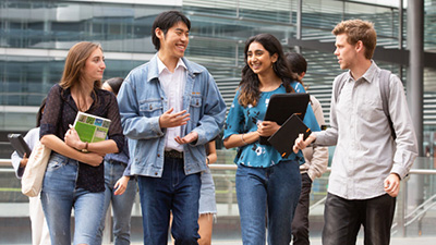 Students standing in a group talking