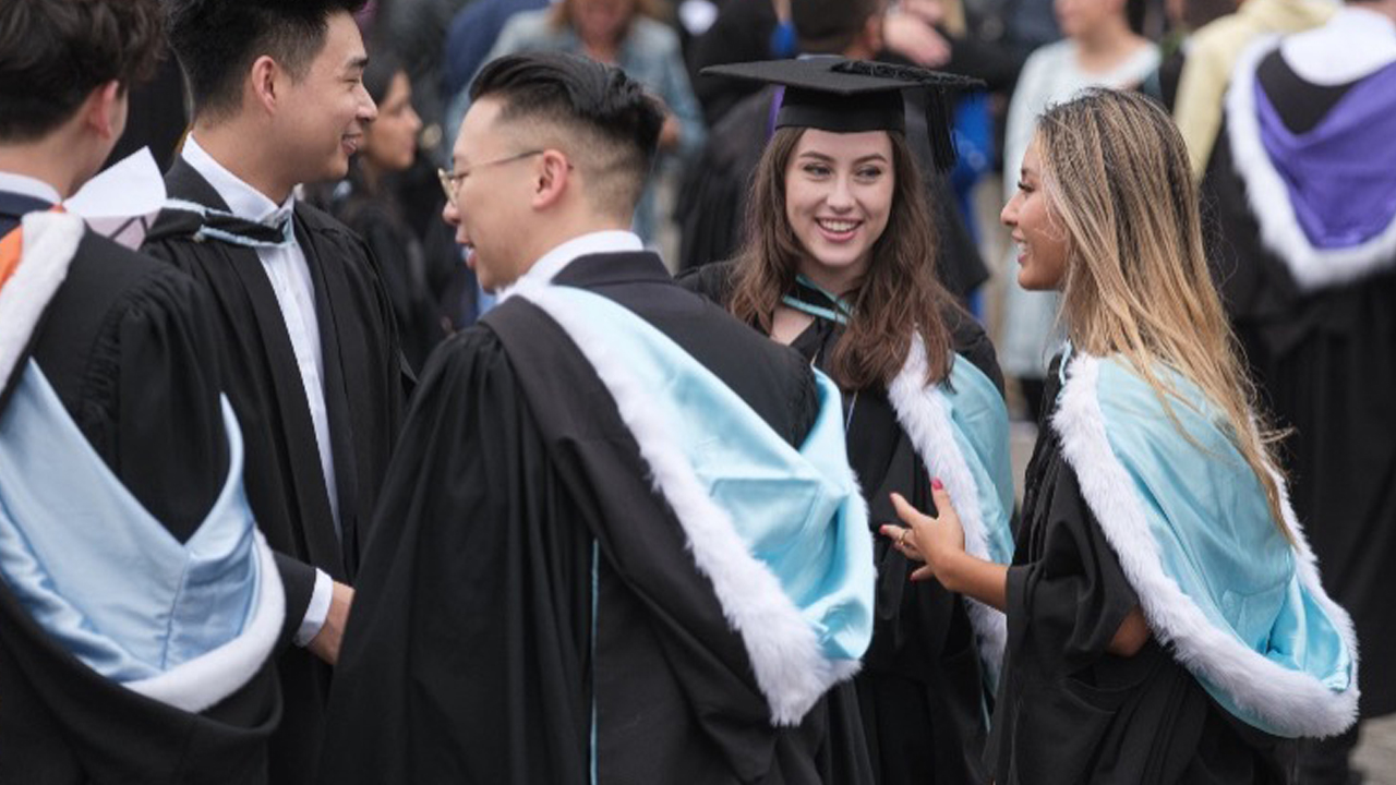 Students in graduation regalia.