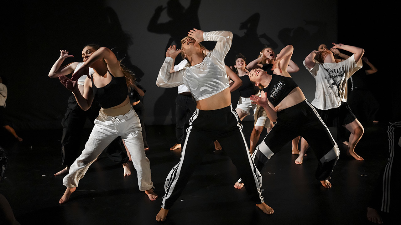 Group of dancers performing a contemporary dance.