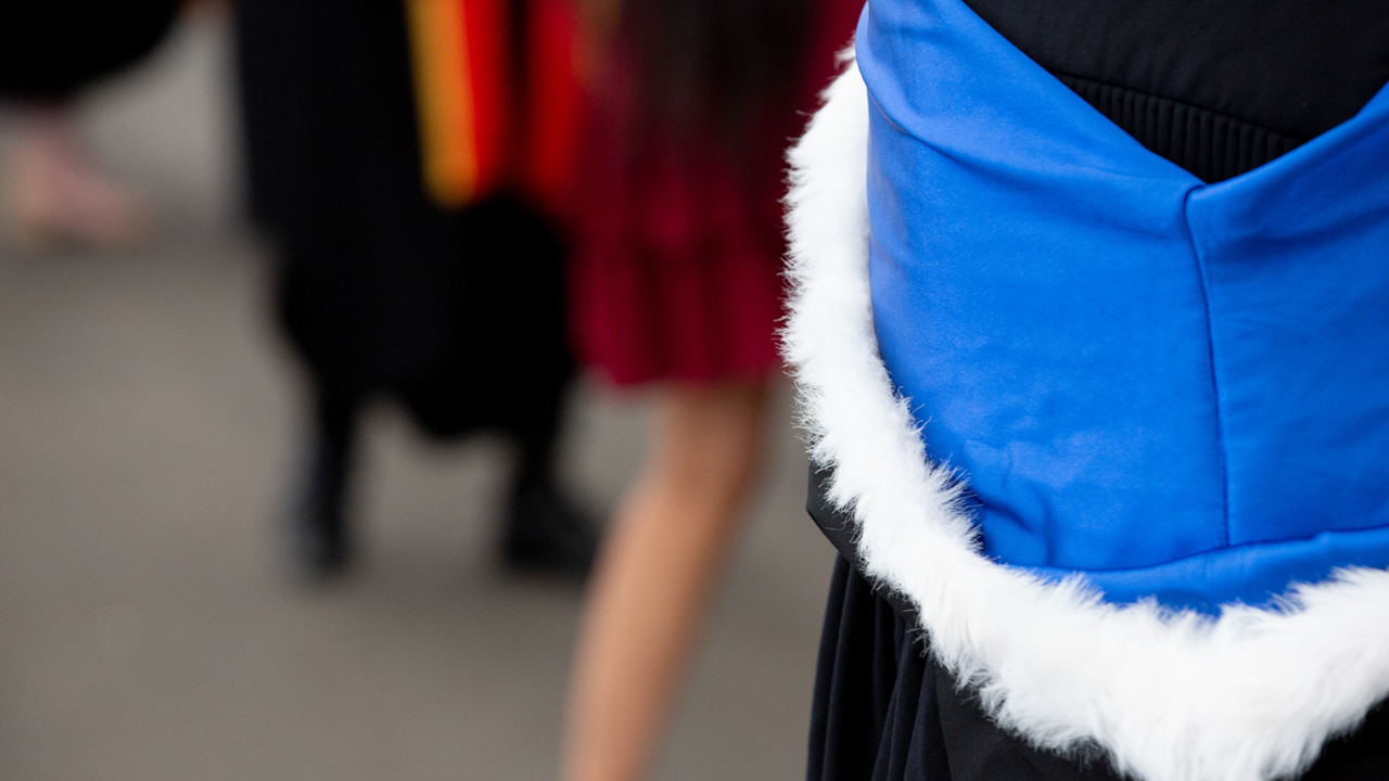 Closeup of science graduation regalia.