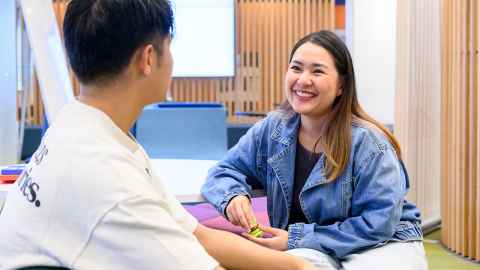 Students happily talking to each other.